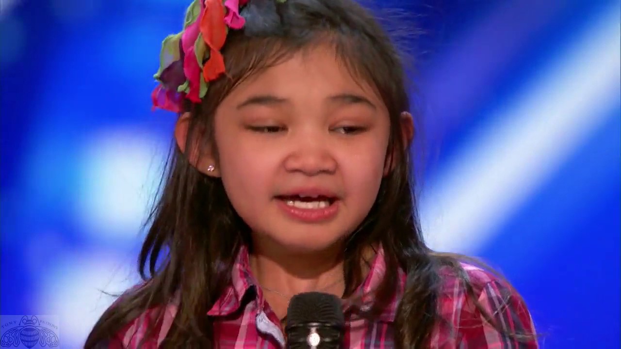 9 year old girl surprises singing 
